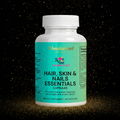 Hair Skin Nails bottle on dark background with gold glitter